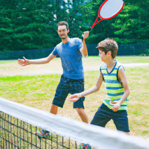 A father and son playing pickleball on the grass