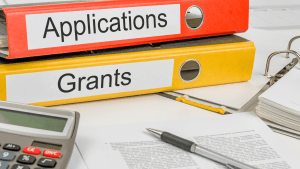 a binder of grant applications